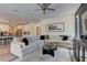 Bright living room featuring a large sectional, contemporary decor, and an inviting open-concept layout at 8335 Beaten Path Ct, Las Vegas, NV 89166