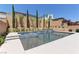 Gorgeous pool and spa with manicured landscaping and privacy wall at 8335 Beaten Path Ct, Las Vegas, NV 89166