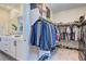 Well-organized walk-in closet with ample storage space for clothing, shoes, and accessories at 8335 Beaten Path Ct, Las Vegas, NV 89166