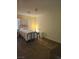 Bedroom featuring carpeted floors and a window with blinds at 8410 Eldora Ave # 1053, Las Vegas, NV 89117