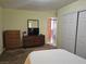 Bedroom featuring closet, dresser, and television at 8410 Eldora Ave # 1053, Las Vegas, NV 89117