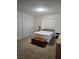 Neutral bedroom featuring three-door closet and window with wooden blinds at 8410 Eldora Ave # 1053, Las Vegas, NV 89117