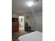 Bedroom with closet, dresser, television, and view of ensuite bathroom at 8410 Eldora Ave # 1053, Las Vegas, NV 89117