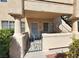 Inviting front entrance with gated access, covered porch, and well-maintained landscaping at 8410 Eldora Ave # 1053, Las Vegas, NV 89117