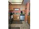 Efficient kitchen space with stainless steel dishwasher, granite countertop, and oak cabinets at 8410 Eldora Ave # 1053, Las Vegas, NV 89117