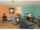 Inviting living room with tile flooring, bright accent walls, and comfortable seating arrangement at 8410 Eldora Ave # 1053, Las Vegas, NV 89117