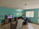 Relaxing living room featuring tile floors, modern furniture, and a bright accent wall at 8410 Eldora Ave # 1053, Las Vegas, NV 89117
