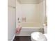 Clean bathroom with a bathtub, shower, and toilet, featuring a neutral color palette at 8507 Titania Ct, Las Vegas, NV 89147