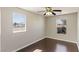 Well-lit bedroom with wood floors, offering ample natural light and neutral paint at 8507 Titania Ct, Las Vegas, NV 89147