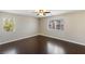 Bright, spacious bedroom with wood floors, offering ample natural light at 8507 Titania Ct, Las Vegas, NV 89147