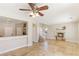 Open-concept living room with fireplace, bar seating area, and tile flooring at 8507 Titania Ct, Las Vegas, NV 89147