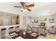 Dining area and living room with fireplace, open kitchen, and tile flooring at 8507 Titania Ct, Las Vegas, NV 89147