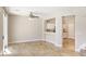 Open-concept living room features tile flooring and a view to the kitchen at 8507 Titania Ct, Las Vegas, NV 89147