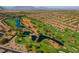 An aerial view of a beautiful golf course and residential community with mountains in the background at 8720 Prairie Hill Dr, Las Vegas, NV 89134