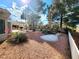 Backyard featuring desert landscaping, patio, garden and mature trees at 8720 Prairie Hill Dr, Las Vegas, NV 89134