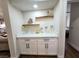 Built-in bar area with cabinetry and shelving is great for entertaining guests at 8720 Prairie Hill Dr, Las Vegas, NV 89134
