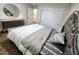 Bedroom with decorative bed frame, hardwood floors, and natural light at 8720 Prairie Hill Dr, Las Vegas, NV 89134