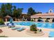 Relax at this community pool, featuring lounge chairs and shade for ultimate comfort at 8720 Prairie Hill Dr, Las Vegas, NV 89134