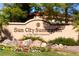 Welcome to Sun City Summerlin: a Del Webb community with colorful foliage and a lush lawn at 8720 Prairie Hill Dr, Las Vegas, NV 89134