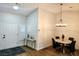 Elegant dining area features modern lighting and seamlessly connects to living spaces at 8720 Prairie Hill Dr, Las Vegas, NV 89134