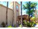Community fitness center with attractive exterior clock tower and verdant landscaping at 8720 Prairie Hill Dr, Las Vegas, NV 89134
