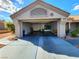 Attached garage with ample storage space and durable concrete flooring at 8720 Prairie Hill Dr, Las Vegas, NV 89134