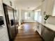 Modern kitchen with white cabinets, stainless steel appliances, and abundant natural light at 8720 Prairie Hill Dr, Las Vegas, NV 89134