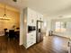 Spacious kitchen features a stainless steel refrigerator and a dining area with natural light at 8720 Prairie Hill Dr, Las Vegas, NV 89134