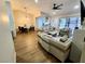 Cozy living room with hardwood floors, modern furnishings and a view into the kitchen at 8720 Prairie Hill Dr, Las Vegas, NV 89134