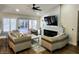 Comfortable living room with a sleek fireplace, plush seating, and bright natural light at 8720 Prairie Hill Dr, Las Vegas, NV 89134
