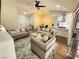 Bright living room featuring neutral furniture, modern decor, and an open floor plan at 8720 Prairie Hill Dr, Las Vegas, NV 89134