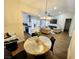 Open concept living space flowing from dining to living room, and showcasing modern design at 8720 Prairie Hill Dr, Las Vegas, NV 89134