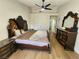 Main bedroom with hardwood floors, ceiling fan, and plenty of natural light at 8720 Prairie Hill Dr, Las Vegas, NV 89134