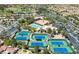 An aerial view showcasing the tennis courts and swimming pool at the community center at 8720 Prairie Hill Dr, Las Vegas, NV 89134