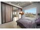 Bedroom featuring city views, polished concrete floors, and modern sliding doors to the main living area at 900 Las Vegas Blvd # 715, Las Vegas, NV 89101