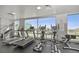 Bright gym featuring treadmills, ellipticals, and floor-to-ceiling windows with an amazing view at 900 Las Vegas Blvd # 715, Las Vegas, NV 89101