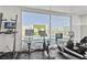 Bright gym featuring stationary bikes, floor-to-ceiling windows and a view of the pool at 900 Las Vegas Blvd # 715, Las Vegas, NV 89101