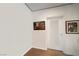 Hallway with white walls, carpeted flooring, accent lighting and decorative artwork at 900 Las Vegas Blvd # 715, Las Vegas, NV 89101