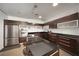 Modern kitchen with sleek cabinetry, stainless steel appliances, and an island with bar stool seating at 900 Las Vegas Blvd # 715, Las Vegas, NV 89101