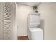 Laundry area with stacked washer and dryer and louvered door in condo at 900 Las Vegas Blvd # 715, Las Vegas, NV 89101