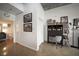 Modern office space with dark wood cabinet, accent lighting and polished concrete flooring at 900 Las Vegas Blvd # 715, Las Vegas, NV 89101