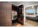 Modern walk-in closet with custom shelves, clothing racks and drawers near the primary bedroom at 900 Las Vegas Blvd # 715, Las Vegas, NV 89101