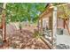 Backyard showing covered patio with outdoor seating area and minimal desert landscaping at 9142 Royal Monarch Ct, Las Vegas, NV 89147