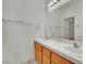 Bright bathroom featuring a double sink vanity, ample counter space, and well-lit mirror at 9142 Royal Monarch Ct, Las Vegas, NV 89147