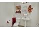 Powder room with pedestal sink, and tiled flooring at 9142 Royal Monarch Ct, Las Vegas, NV 89147