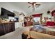 Large bedroom features a ceiling fan, entertainment center, and spacious walk-in closet at 9142 Royal Monarch Ct, Las Vegas, NV 89147