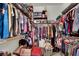 Walk-in closet with custom shelving and ample hanging space for organized storage at 9142 Royal Monarch Ct, Las Vegas, NV 89147