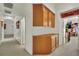 Bright hallway features built-in storage cabinets and leads to various rooms in the home at 9142 Royal Monarch Ct, Las Vegas, NV 89147