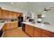 Spacious kitchen with tile countertops, wood cabinets, and stainless steel appliances at 9142 Royal Monarch Ct, Las Vegas, NV 89147