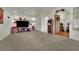 Open living area with hardwood and carpet flooring leading to a dining area and office at 9142 Royal Monarch Ct, Las Vegas, NV 89147